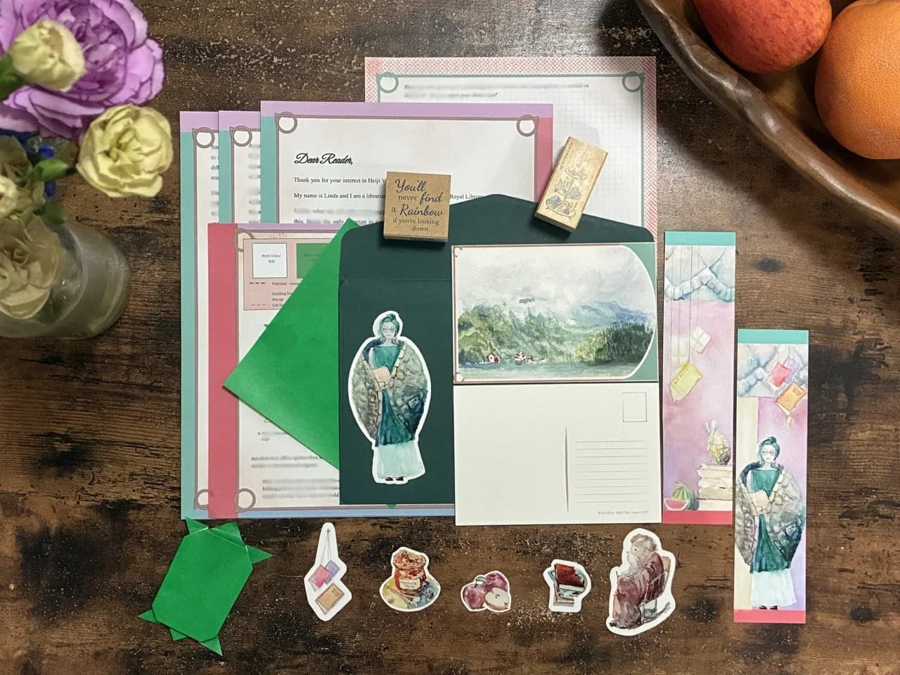 Heiji Village letter set arranged on a wooden table