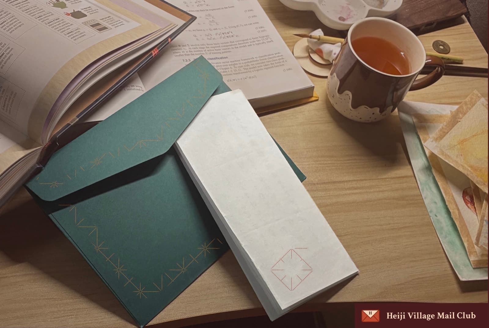 Letters, books and tea on a writing desk